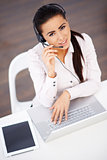 High angle shot of business woman sitting at the desk