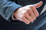 Businessman with thumb up sign