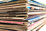 Stack of vinyl records in covers made of paper