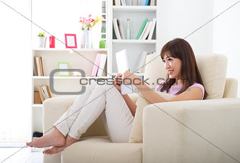asian girl surfing the internet with tablet pc