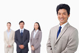 Businessman standing with his team behind him