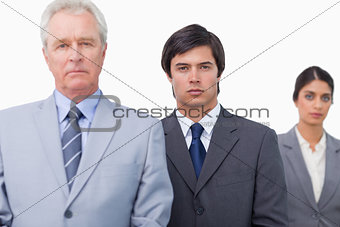 Mature salesman with his employees