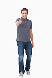 Smiling young man giving thumb up