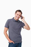 Smiling young man on his mobile phone