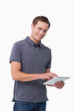Smiling young man with tablet computer