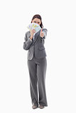 Businesswoman approving and hiding with bank notes in her hand