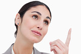 Close up of businesswoman looking and pointing up