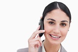 Close up of smiling businesswoman talking on cellphone