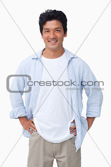 Smiling male with hands on his hip