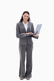 Businesswoman smiling with a laptop