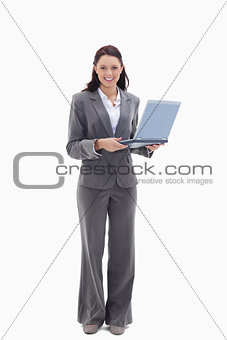 Businesswoman looking happy with a laptop