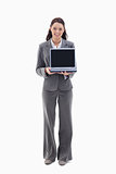 Businesswoman smiling while showing a laptop screen