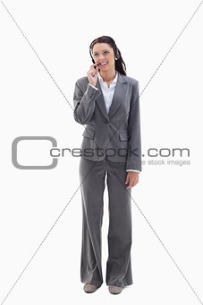 Businesswoman watching on the top speaking in a headset