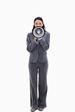 Expressive businesswoman speaking in a megaphone
