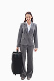 Businesswoman smiling with a suitcase