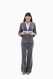 Businesswoman watching a touch pad