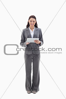 Businesswoman smiling with a touch pad