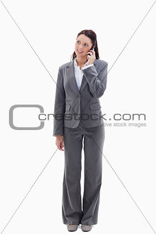 Businesswoman on the phone looking up