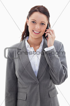 Businesswoman smiling over the phone