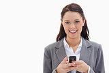 Businesswoman smiling and holding her mobile
