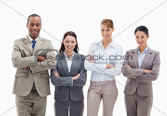 Close-up of a business team smiling side by side and crossing th
