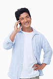 Smiling male on his mobile phone