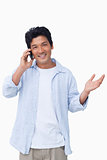 Smiling male talking on the cellphone