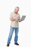 Mature man working on his laptop