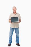 Smiling mature male presenting his laptop screen