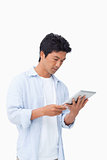 Male looking at his tablet computer