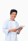 Smiling male with his tablet computer