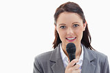 Businesswoman holding a microphone