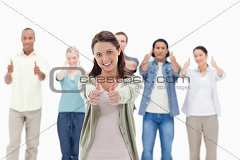 Close-up of people with their thumbs-up 