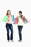 Girls smiling with shopping bags