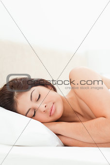 Woman sleeping with her head on the pillow