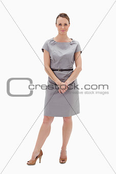 Woman in dress holding her hands