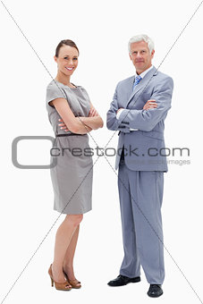 White hair man face to face with a woman crossing their arms and