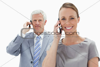 Close-up of a white hair businessman making a call with a smilin