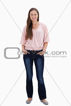 Woman smiling with her hands in her pockets
