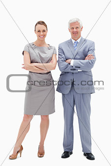 White hair man with woman crossing their arms and smiling