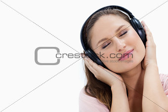Close-up of a girl listening to music 