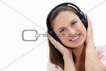 Close-up of a smiling girl wearing headphones 