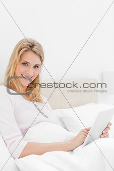 Closer shot, Woman using a tablet pc while looking up and to the