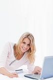 Woman looking forward and smiling as she orders online