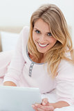 Woman holding tablet pc and smiling 