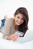 Close up, woman smiling with credit card and tablet in hand, lyi
