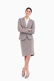 Smiling businesswoman with her arms crossed