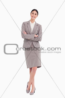 Smiling businesswoman with her arms crossed