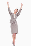 Young businesswoman with arms raised