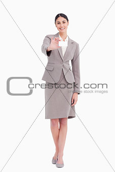 Young saleswoman showing her blank business card
